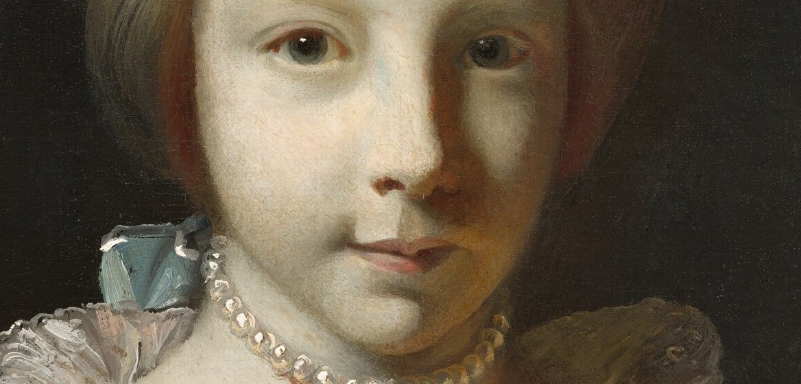 Her pearl necklace and jewelled hair ornament signal gentility and innocence.