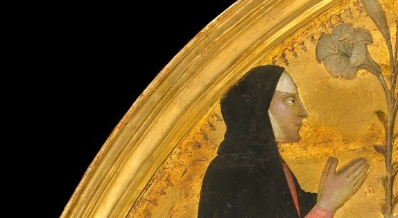 She wears the white wimple of a lay penitent or a nun.