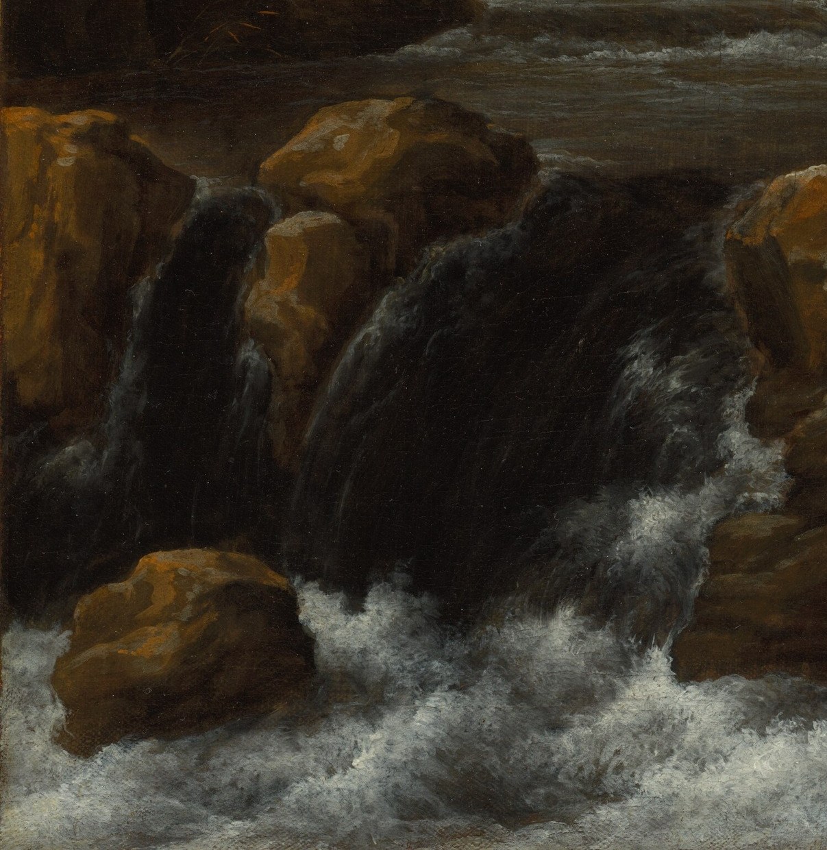 The rough textured stone contrasts with the liquid chaos of the water; lichen and shadow give the rocks geological permanence against the transient torrent.