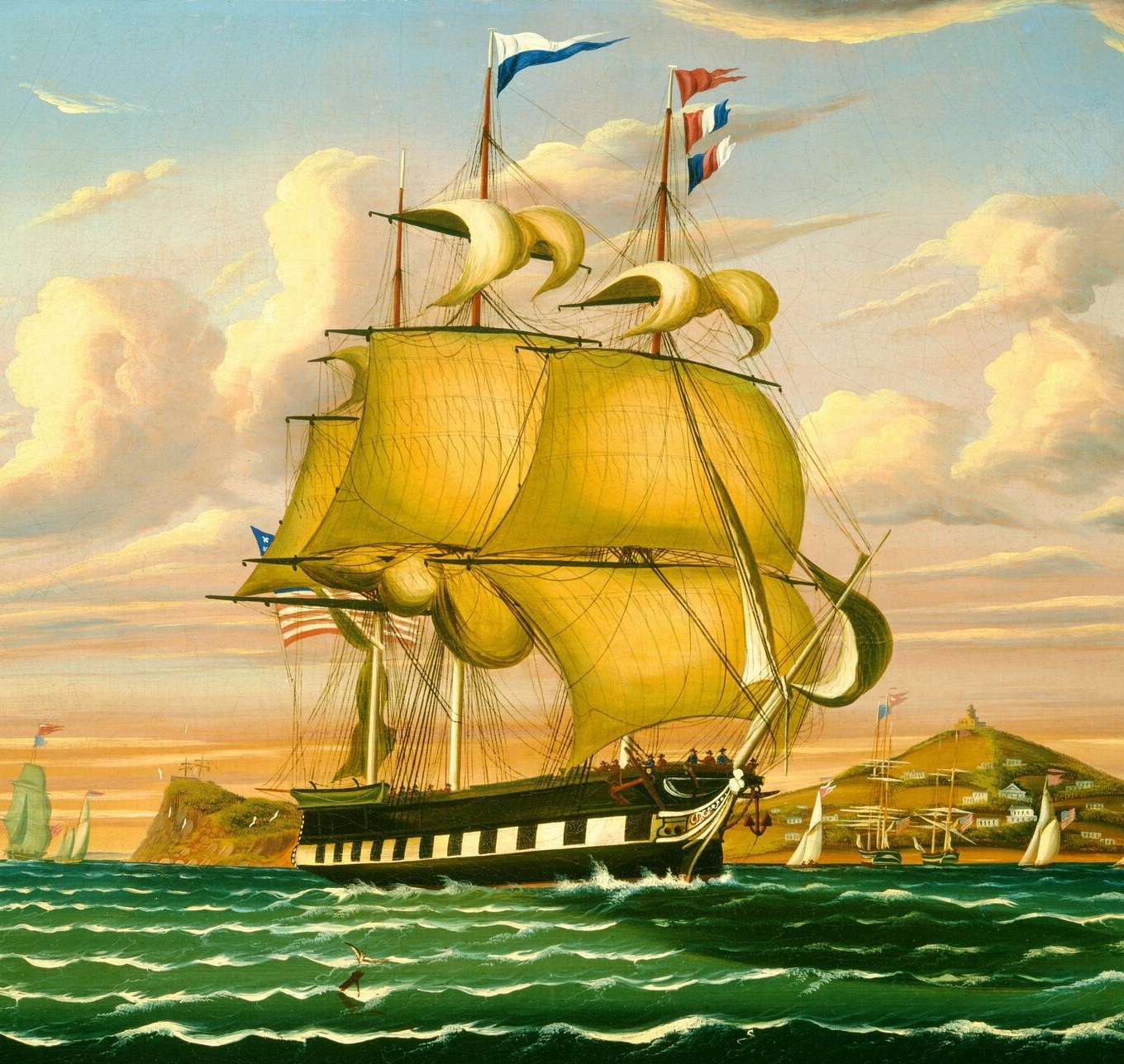 The dominant subject , amber-gold sails fully set and catching wind, the hull riding low, conveying power and momentum across the harbor.
