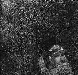 Her face is held in shadow.
