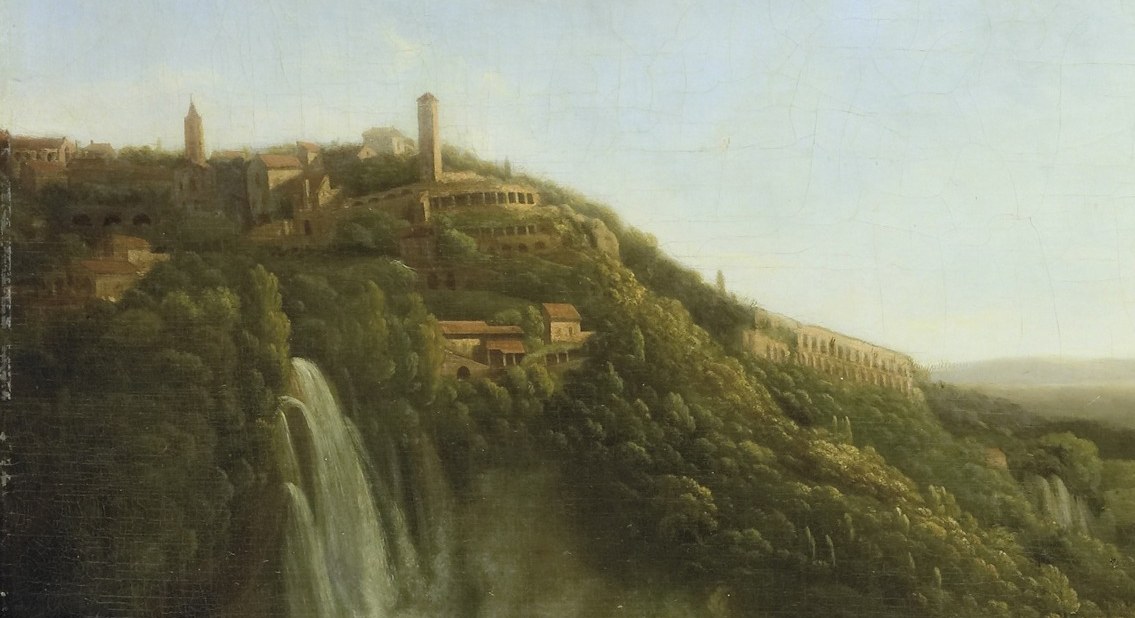 Beyond the dramatic waterfalls, a small village rests on a hill.