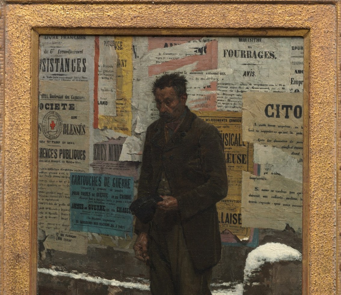 But the details on the wall behind him tell a wider story.