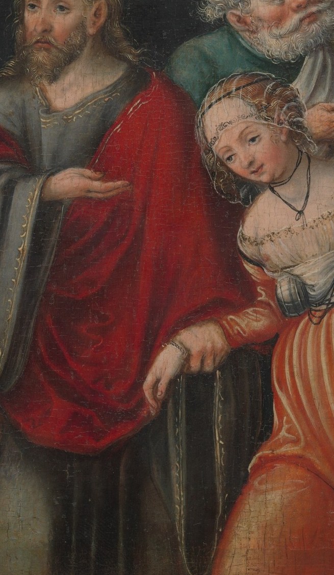 Her supplicant posture and vivid costume isolate her emotionally; the red signals both danger and passion.