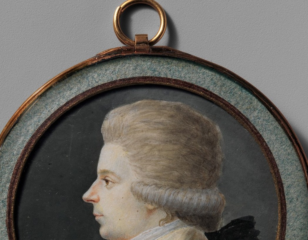 The voluminous white-powdered wig signals upper-class status; the rolled or tightly curled sides typical of 1780s-1790s fashion date the sitter precisely within a decade.