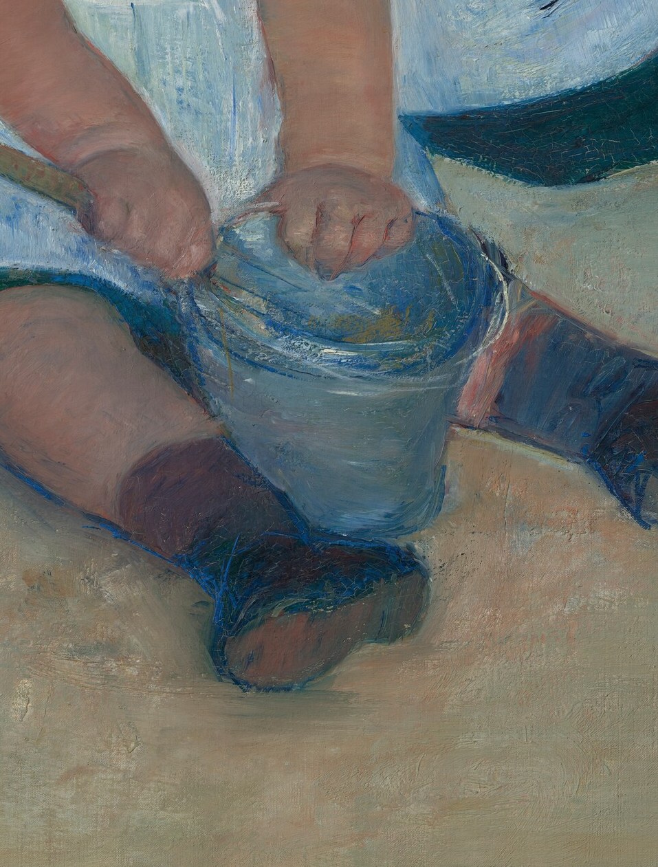 The bucket is the shared object around which both children orbit, making it the silent hinge of the composition and a concrete sign of cooperative play.