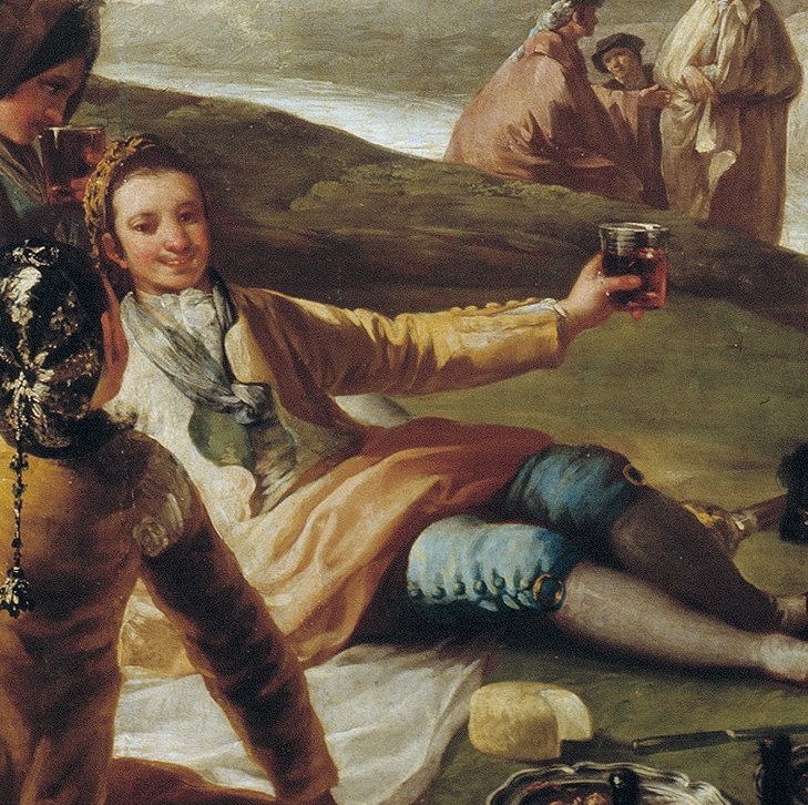 The man in the blue coat raises his glass.