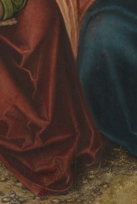 The rich, voluminous fabric creates a sense of earthly presence and maternal warmth, contrasting with the spiritual figures.