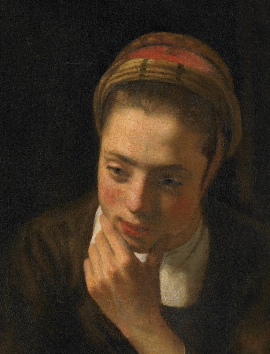 This girl at a window looks lost in thought.