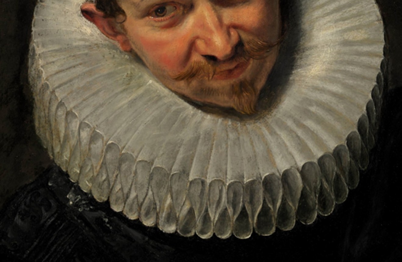 He wears a starched ruff, a symbol of his status.