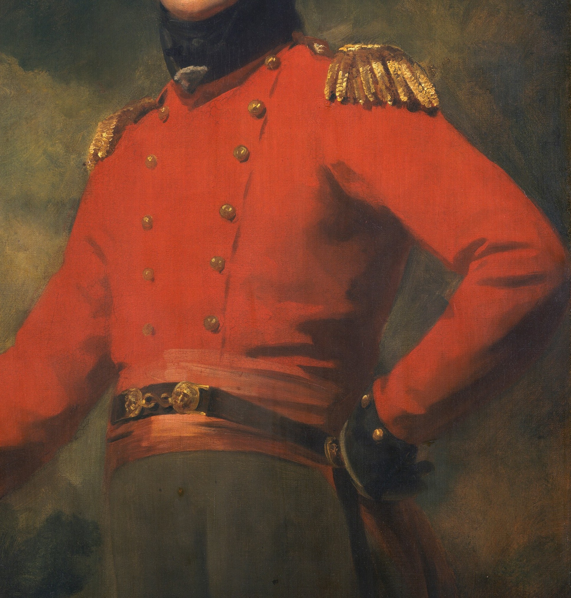 His uniform's rich red and gold speak of rank and duty.
