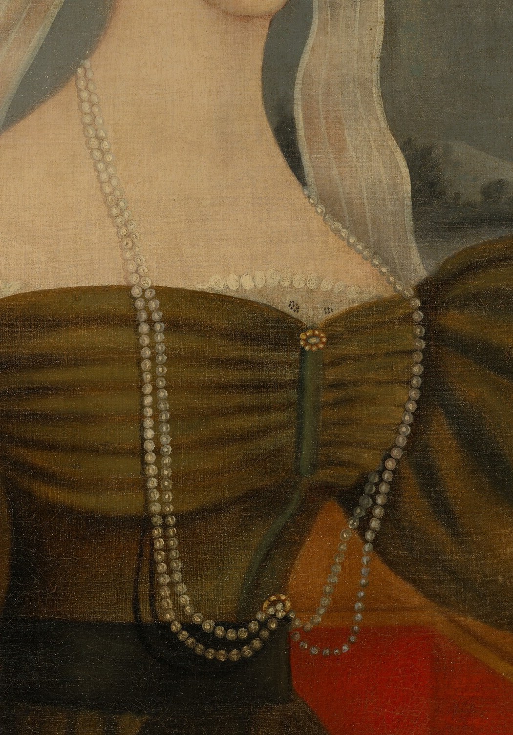 The double strand of pearls is a prominent symbol of wealth and status, adding a touch of elegance.