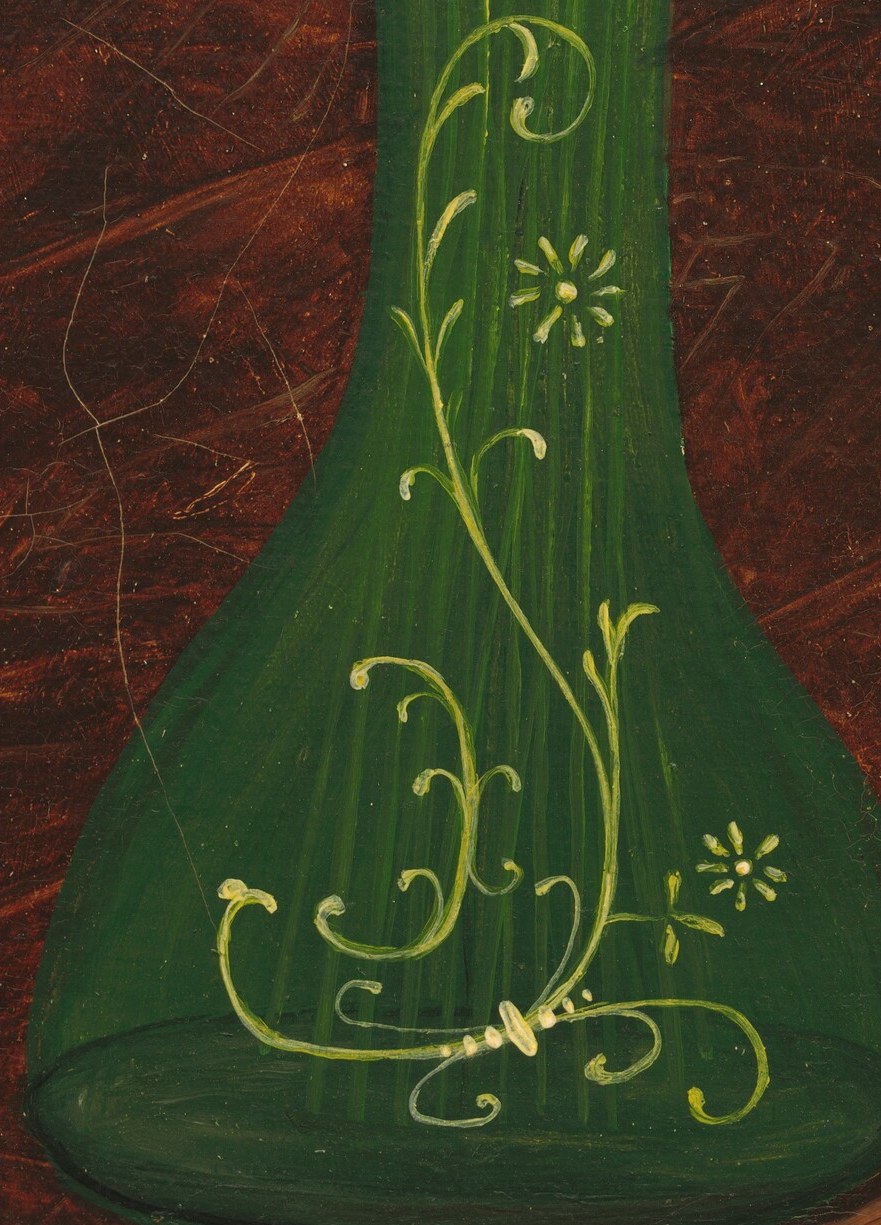Gold patterns swirl on the green surface.