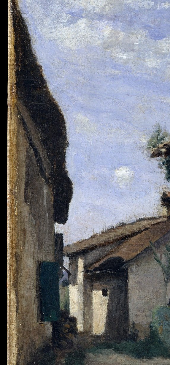A texturally rich surface of pale plaster, bare stone, and shadow; a close-up would reward viewers with the passage of time written into the building's skin.