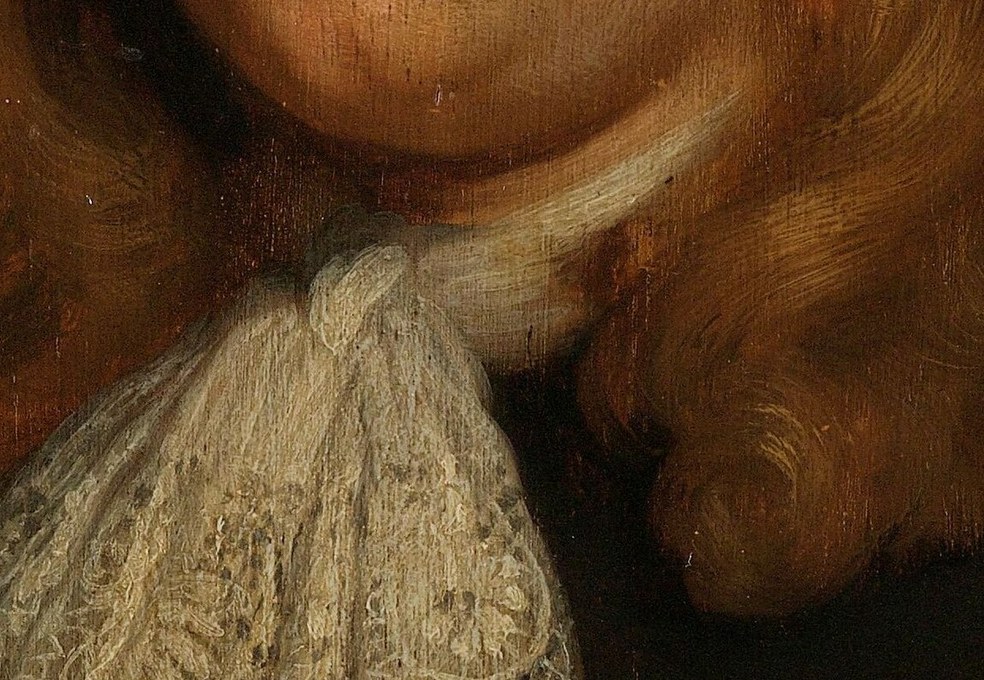 His delicate lace cravat shows his social standing.