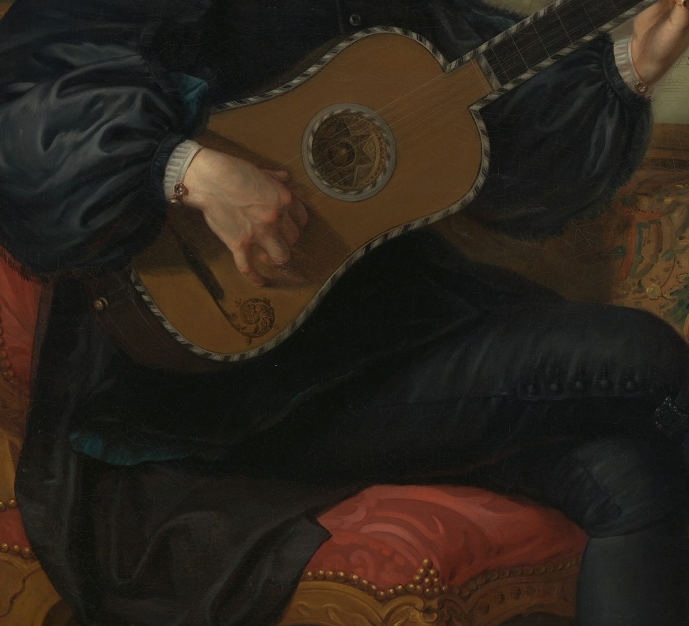 Look at his guitar. The strings are real gut.