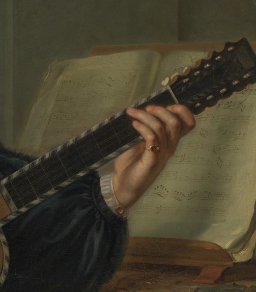 His left hand presses a specific chord.