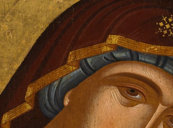 The Virgin's downcast eyes hint at future sorrow.