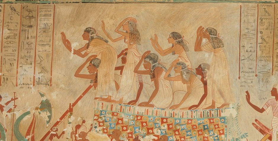 Tightly packed profile figures in white linen show the ordered hierarchy of funerary attendance; slight variation in gesture and headdress rewards a slow close read.