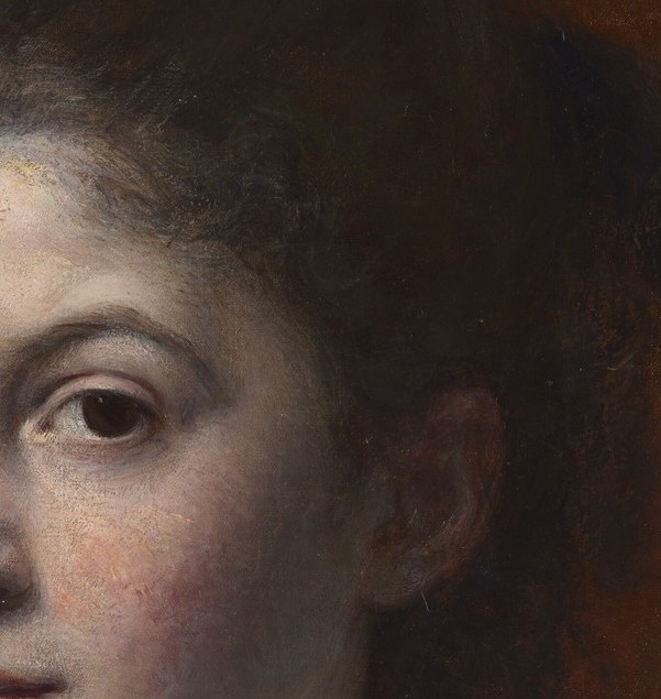 Her dark hair frames a thoughtful face.