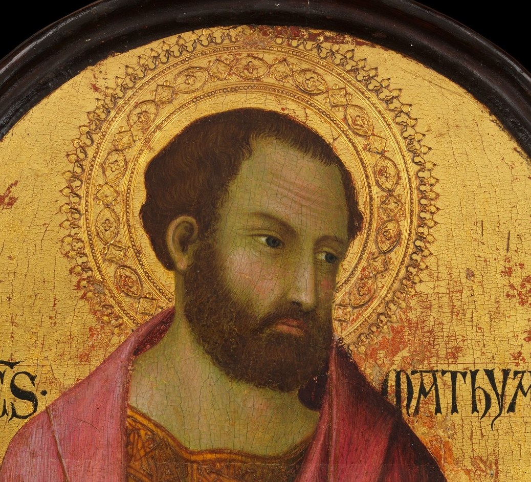A golden halo lifts him out of earthly space.