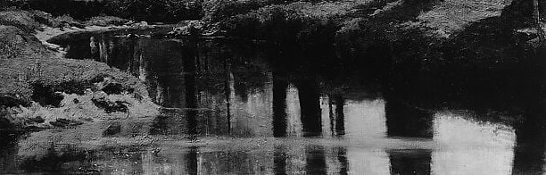 The glassy surface creates a mirror image, adding depth and a sense of calm, almost surreal, stillness.