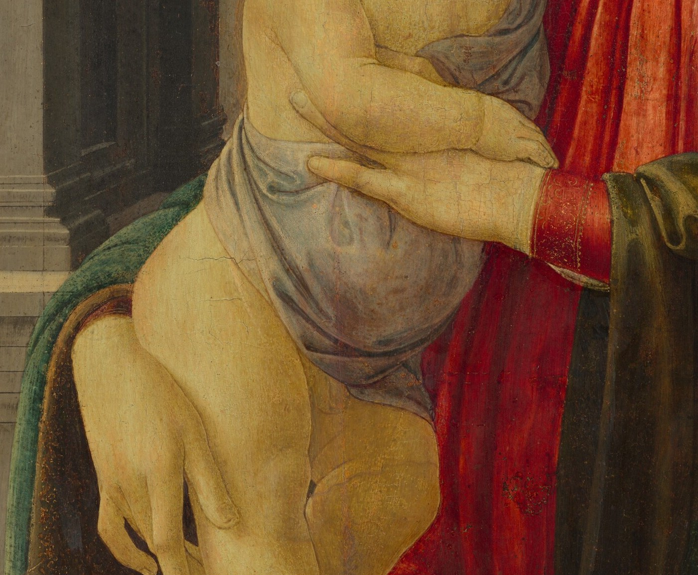 Delicate, elongated fingers characteristic of Botticelli; the gentle but secure grip communicates both protection and offering