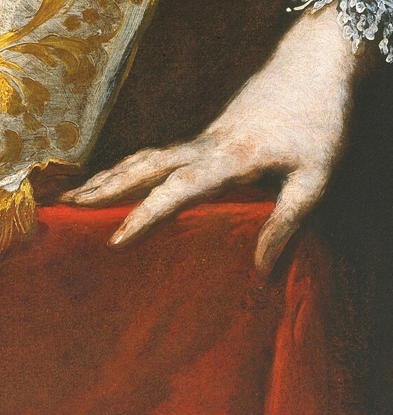 Resting on the table, his hand appears relaxed yet firm, suggesting a moment of contemplation.