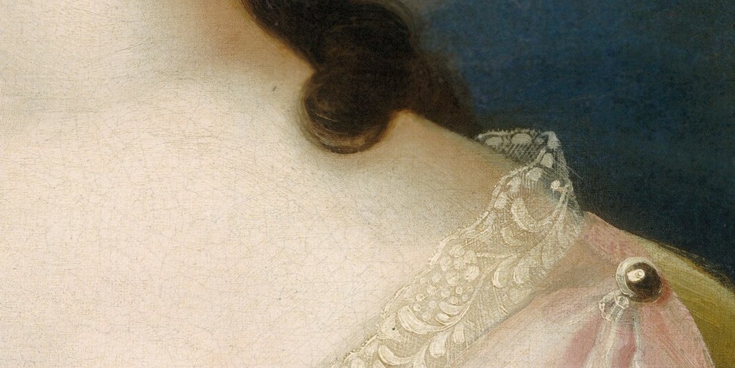 Look at the delicate lace trim on her sleeves.