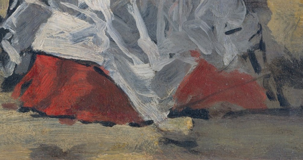 A flash of red beneath the hem: her signature provocation.