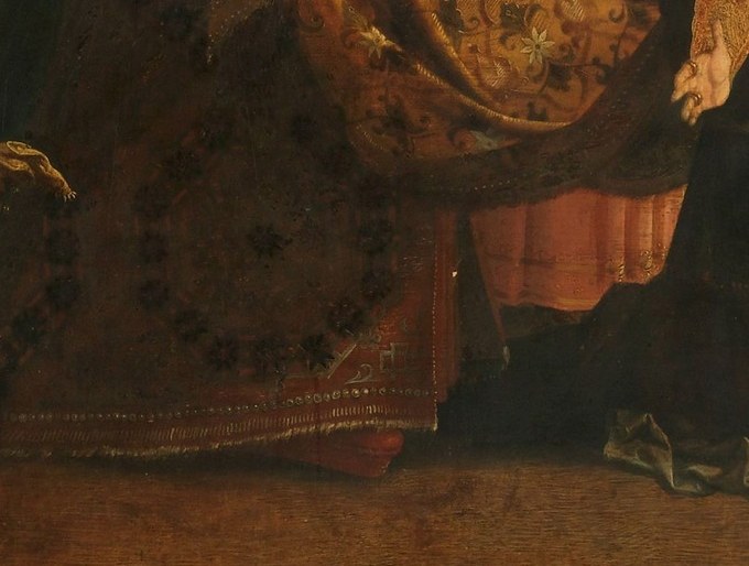 Her ornate skirt gleams with gold.