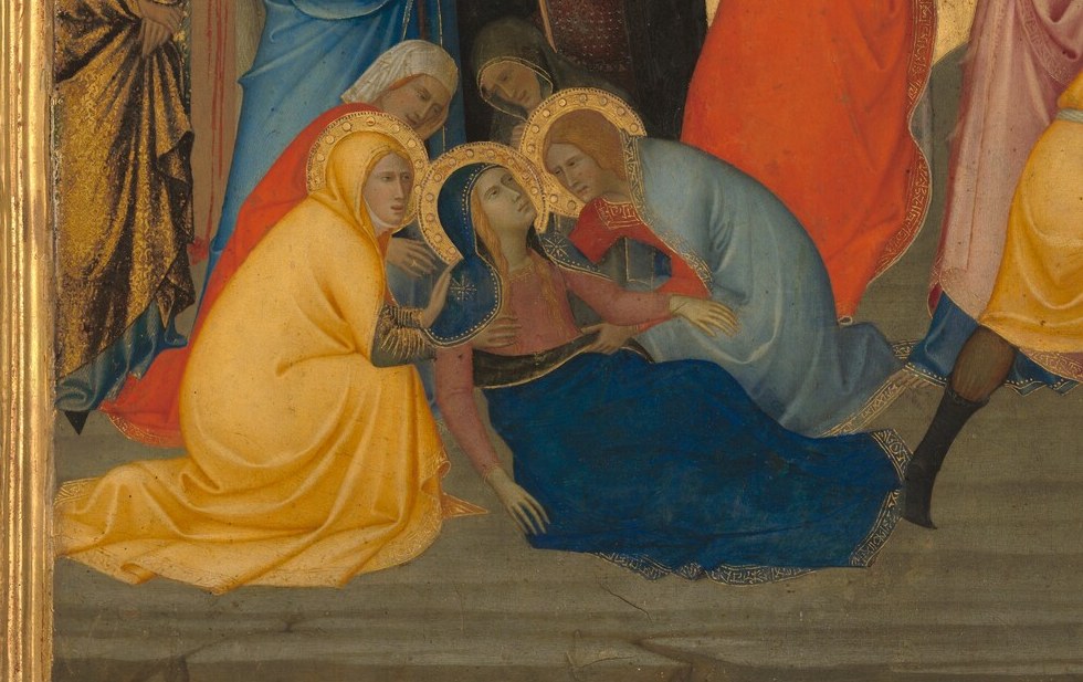 Mourning figures collapse at the foot of the cross.