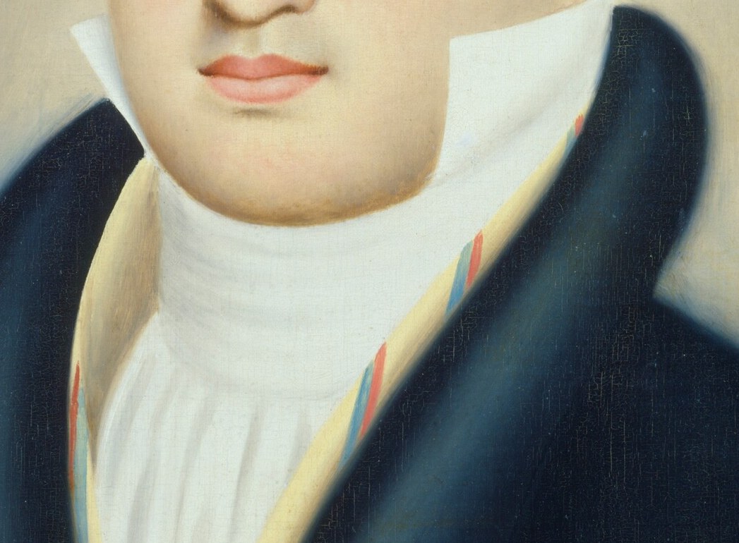 Look closely at the texture of his ruffled turtleneck.