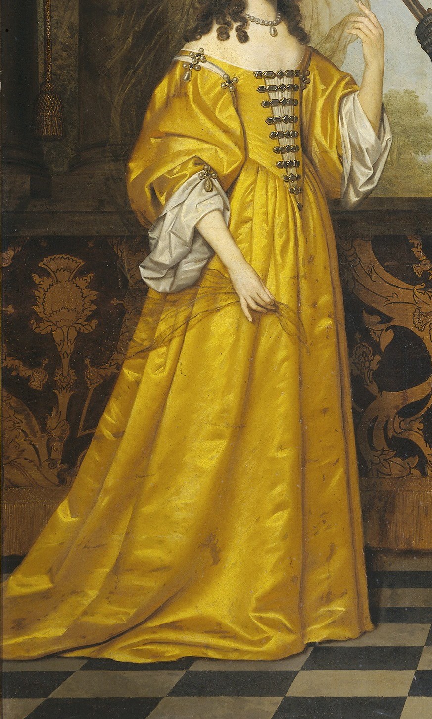 Maria Stuart, age 16, wears a dress of luminous yellow silk.