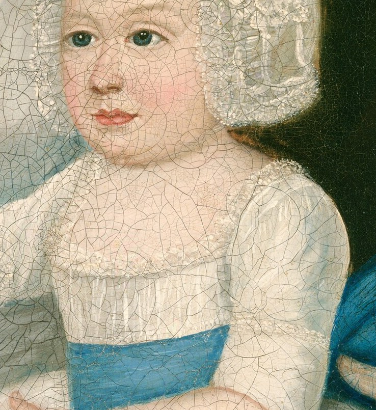 The child's blue sash adds a vibrant touch of innocence.