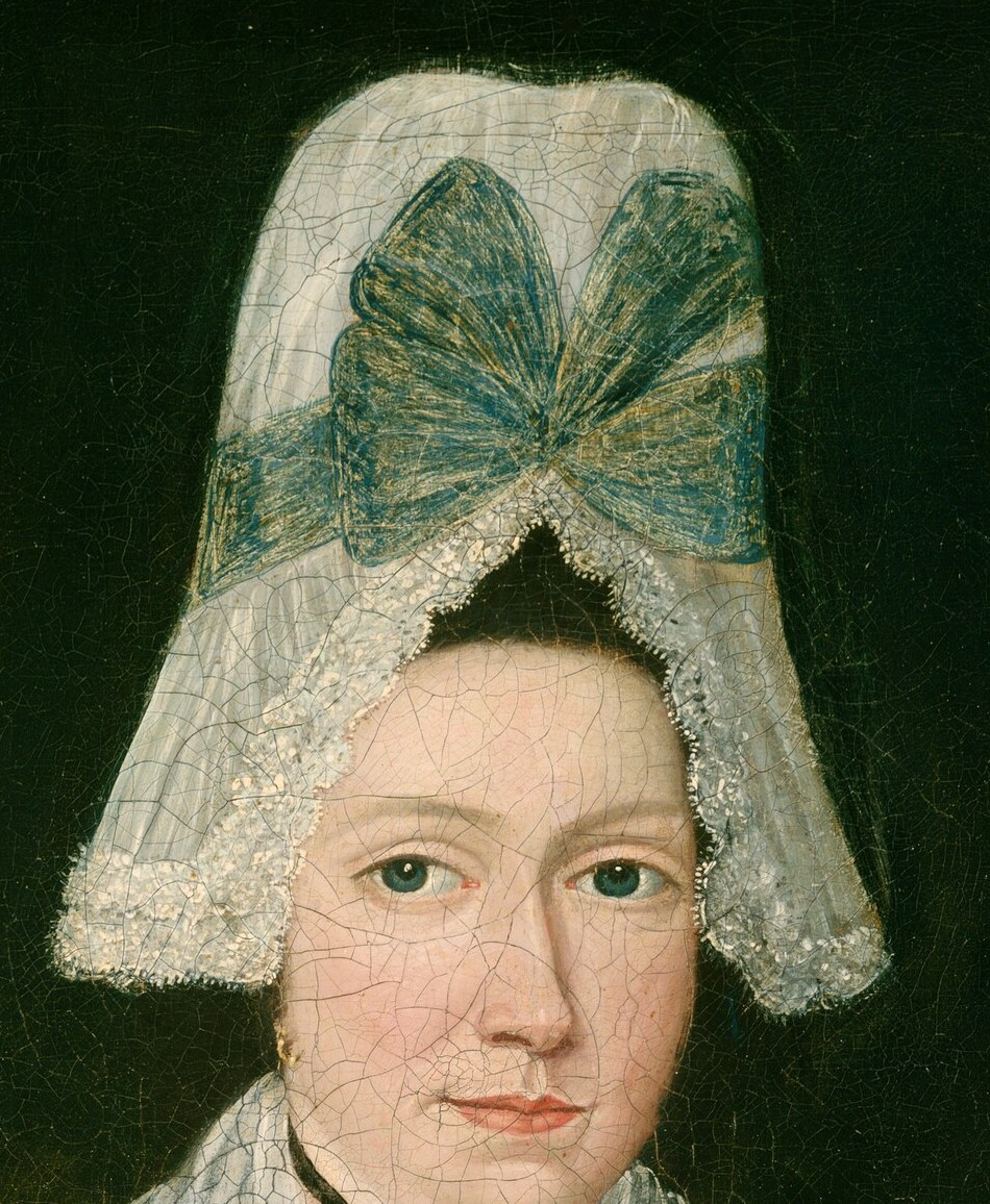 The mother's bonnet, with its bright blue bow, was high fashion.