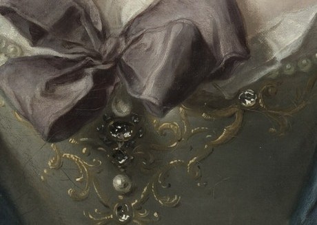 Look at the intricate gold embroidery on her gown.
