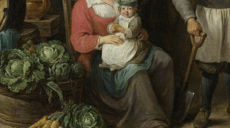 A carrot lies on the dirt. The harvest feeds the family right where they sit.