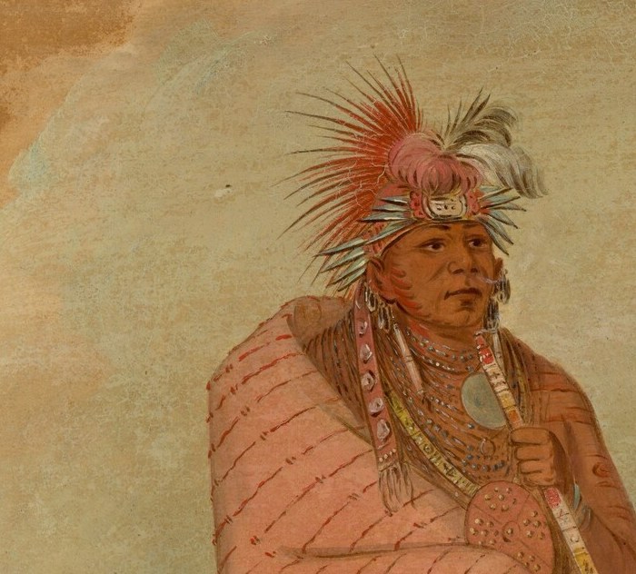 And the detailed feathered headdress, signaling his status.
