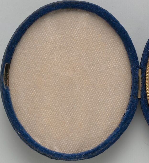 It is a locket, and one side is empty.