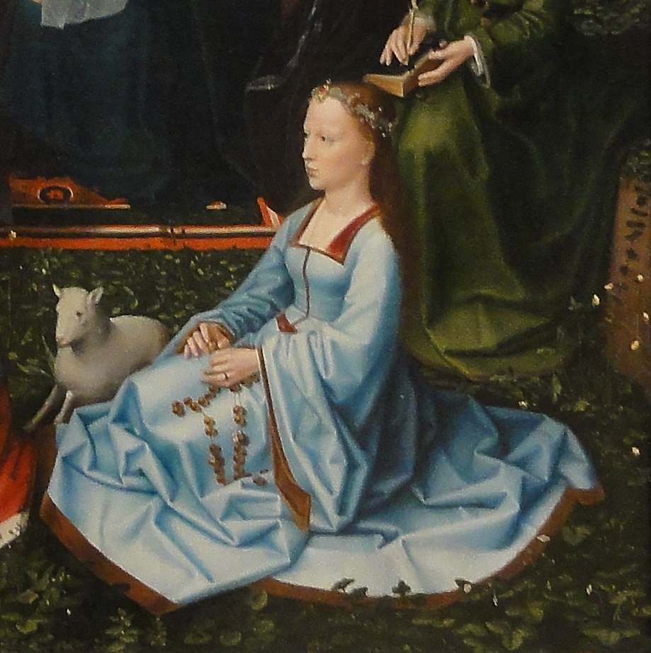 This woman prays the rosary for someone.