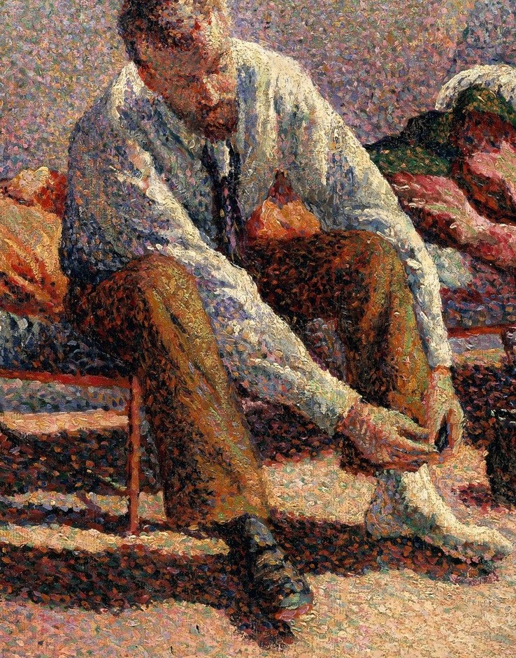 A man calmly ties his shoe to begin the day.