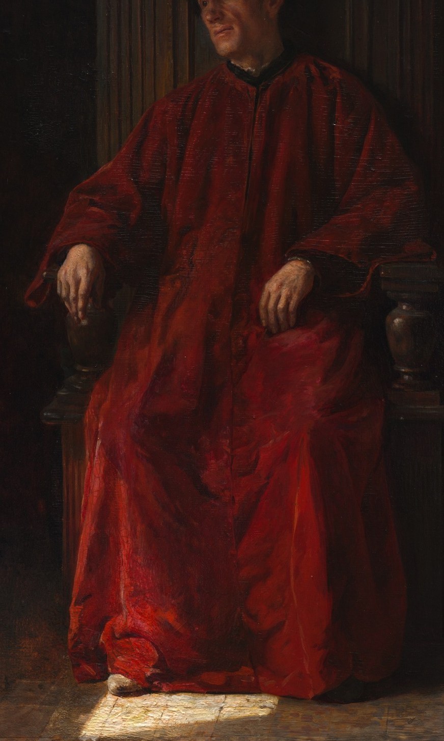 His red robe shows his high status.