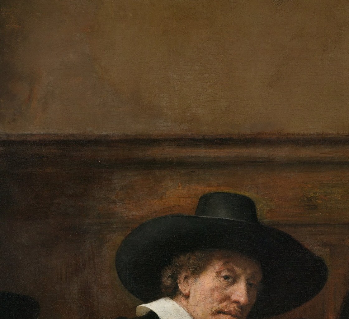 Strongly lit relative to the leftmost figure; his eyes engage the viewer head-on, contributing to the painting's unnerving collective eye-contact.