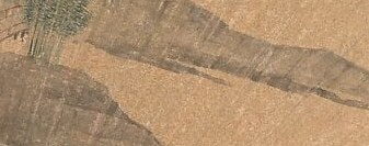 The artist used fine, crisscrossing brushstrokes to build texture.