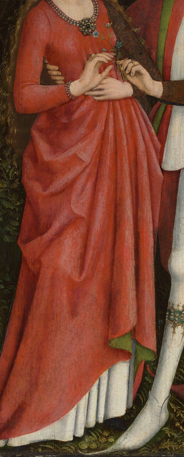 The rich, flowing fabric and vibrant color emphasize her presence and the importance of the occasion.