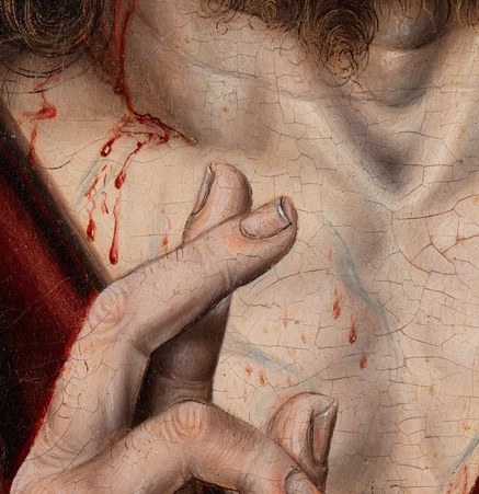 Blood from the spear wound appears at the collar. Easy to miss.
