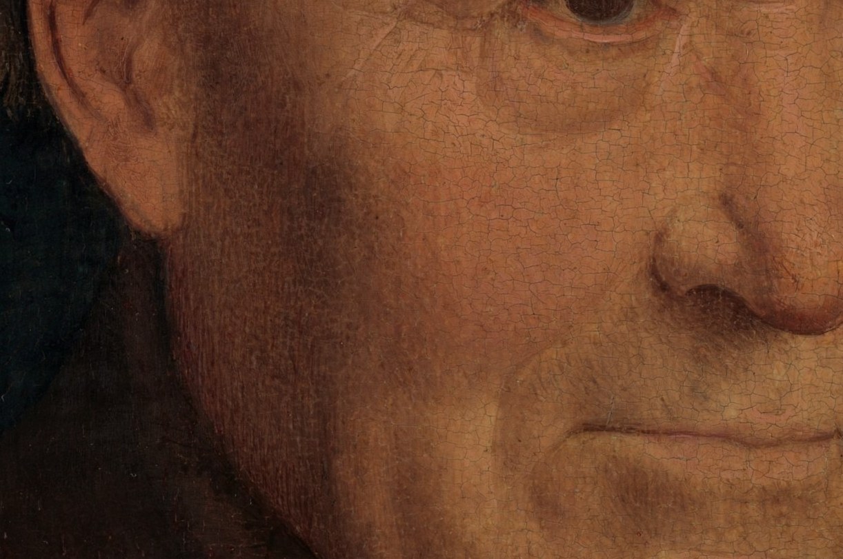 Notice the detailed texture of his aged skin.