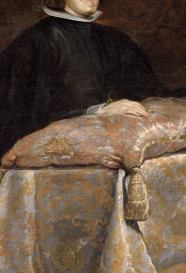 The voluminous dark robe conveys a sense of gravitas and solemnity, typical of royal portraiture.