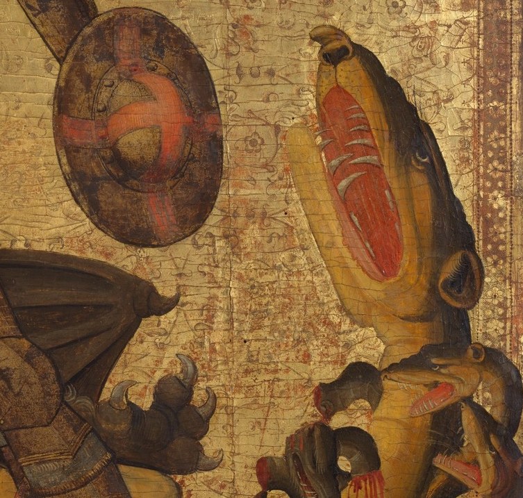 Open jaws with visible teeth and a red interior , the face of vanquished evil, simultaneously terrifying and pitiful in defeat.